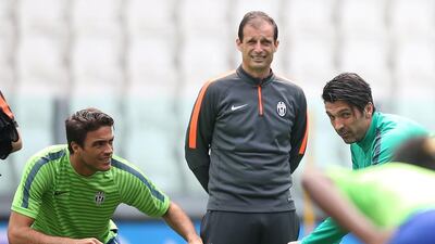 Juventus' coach Massimiliano Allegri, centre, has had a positive impact on Juventus. Marco Bertorello / AFP