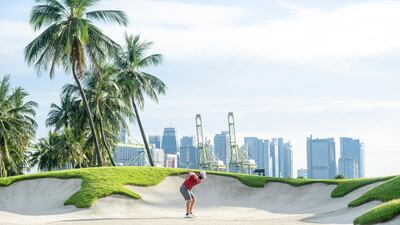 Jon Rahm hits his shot from the fifth bunker during the final round of LIV Golf Singapore at Sentosa Golf Club. AP