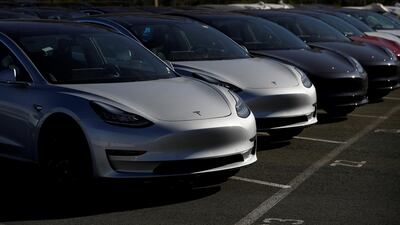 Tesla Model 3 electric vehicles in Richmond, California. Analysts question whether production rate is sustainable. Stephen Lam/Reuters
