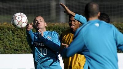 Inter’s Dutch midfielder Wesley Sneijder, left, jokes around in training yesterday.