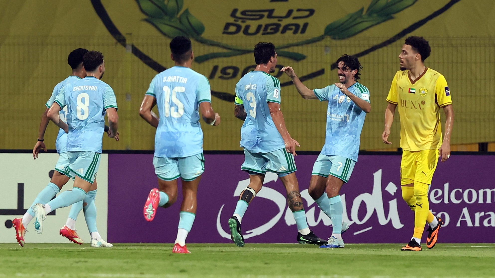 Roger Ibanez, second left, celebrates after putting Al Ahli 1-0 up. Chris Whiteoak / The National