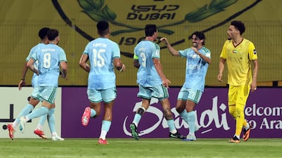 Roger Ibanez, second left, celebrates after putting Al Ahli 1-0 up. Chris Whiteoak / The National