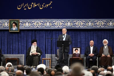 Iranian President Masoud Pezeshkian, centre, at a ceremony where he was endorsed by the country's supreme leader, Ayatollah Ali Khamenei, in Tehran. EPA