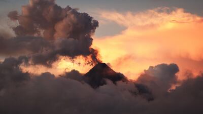 Mount Mayon spews ash as seen from Legazpi City in Albay province, south of Manila. Ted Aljibe / AFP Photo
