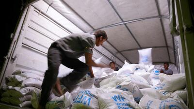 A Red Crescent and United Nations aid convoy carries food aid in the rebel held besieged town of Douma, Syria. Bassam Khabieh / Reuters