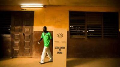 A man leaves a voting booth after filling his ballot during presidential elections in Accra, Ghana.
