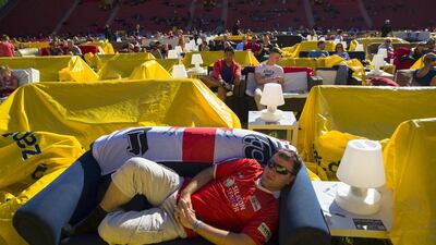 People sit on sofas as they watch a 2014 World Cup match at the Alte Forsterei stadium in Berlin on June 15, 2014. Thomas Peter / Reuters