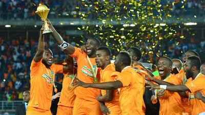 Yaya Toure holds aloft the Africa Cup of Nations trophy after Ivory Coast's win in the final against Ghana on Sunday. Gavin Barker / EPA