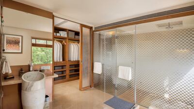 Bathroom with privacy glass and walk-in wardrobe 