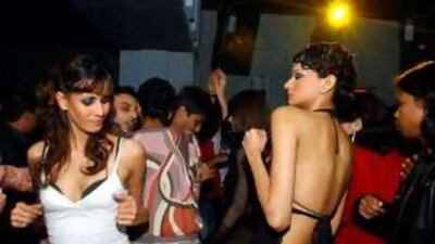 Indian models dance at the opening night of a club in Calcutta. "We actually do the nightclubs and the drinking and the random conversations," Meenakshi Reddy Madhavan says, "and they are just as real to us here as they would be if we were in downtown Manhattan."