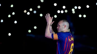 Barcelona's Andres Iniesta acknowledges the fans. Lluis Gene / AFP