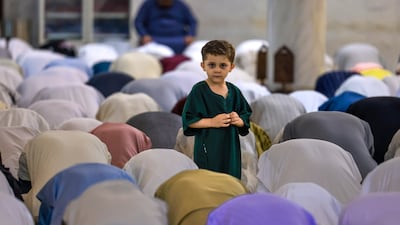 Worshippers at Bani Hashim Mosque at Friday prayers, marking the end of the holy month. Victor Besa / The National