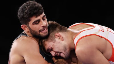 Mohammadhadi Saravi (L) of Iran landed bronze in Greco-Roman wrestling.