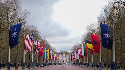 Flags of Nato and its member states are displayed along The Mall in London. Reuters