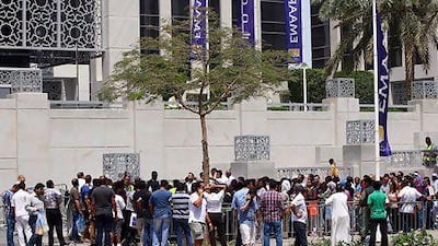 People who queued for hours in the hopes of buying property had to be dispersed by police after huge queues caused chaos. Satish Kumar / The National