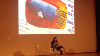 Kristine Khouri displaying a poster questioning the occupation of Palestine during the first day of the Sharjah March Meeting event that is taking place in the theatre all week. Images taken by Anna Seaman.