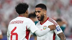 UAE's forward #20 Luan Pereira celebrates scoring his team's first goal with UAE's midfielder #6 Abdullah Ramadan during the FIFA World Cup 2026 Asian qualifier football match between the United Arab Emirates and Iraq at the Mohammed bin Zayed Stadium in Abu Dhabi on November 13, 2025. (Photo by Fadel SENNA / AFP)