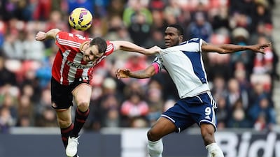 John O’Shea of Sunderland heads the ball clear under pressure from Brown Ideye of West Brom during their Premier League draw on Saturday. Laurence Griffiths / Getty Images