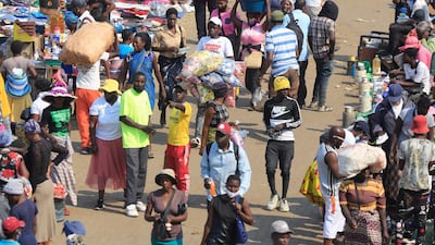 Crowds of people throng a market place in Mbare, Harare, Zimbabwe. The country generates the bulk of its foreign currency earnings from exports of tobacco, gold and platinum. EPA