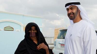 SHOWKA, RAS AL KHAIMAH, UNITED ARAB EMIRATES - November 22, 2012: HH General Sheikh Mohamed bin Zayed Al Nahyan Crown Prince of Abu Dhabi Deputy Supreme Commander of the UAE Armed Forces (R), visits Ms Ghuwayya Khubab Saeed Ghaseeb (L), at her home in in a remote village on the boarder of Ras Al Khaimah and Fujairah. .( Ryan Carter / Crown Prince Court - Abu Dhabi )