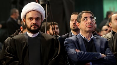Akram al Kaabi, left, pictured with pro-Iranian Hezbollah Lebanese minister Hussein Haj Hassan in Beirut, is wanted by the US. Getty Images