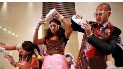 From left, Helena Houle, Maya Siblini and Moustafa Hamwi take part in the science festival's "slime workshop".