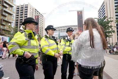 Police wear Taylor Swift friendship bracelets amid heightened security at Wembley. PA