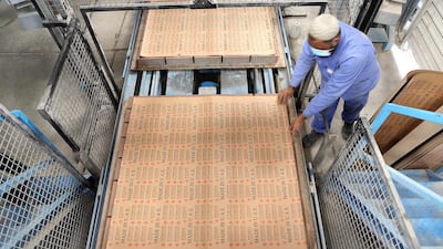 A Ducon Industries worker does block packaging at the company's factory in Dubai. Pawan Singh / The National