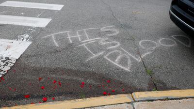 Red flower petals lie on top of blood stains after US Immigration and Customs Enforcement agents shot dead a driver in Biddeford, Maine. Reuters
