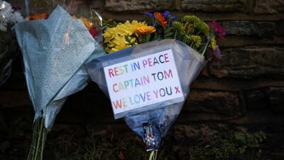 Flowers are seen at the entrance of The Coach House, the residence of Captain Sir Tom Moore, after his family announced that the centenarian fundraiser had died. Reuters