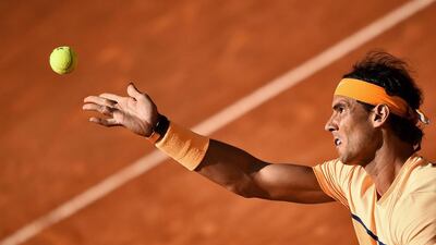 Rafael Nadal of Spain serves the ball to Australia’s Nick Kyrgios during their match at the Italian Open. Filipo Monteforte / AFP