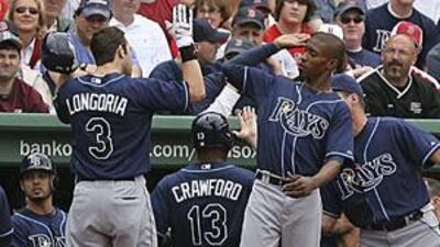 Tampa Bay Rays' Evan Longoria, is congratulated by BJ Upton, right, after driving in Carl Crawford (13) on a two-run home run.