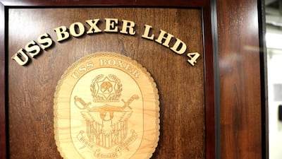 The coat of arms of the USS Boxer is pictured as it sails in the Arabian Sea off Oman.