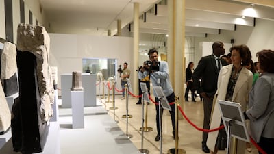 Iraqi officials speak to Ms Azoulay. The national museum was looted following the US invasion in 2003. EPA