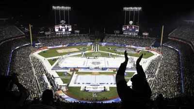 Fans cheer before NHL outdoor hockey game at Dodger Stadium in Los Angeles on Saturday. Jae C Hong / AP Photo