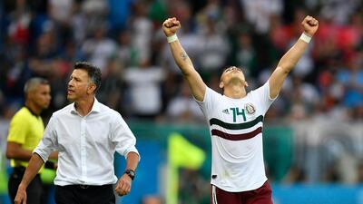 Mexico's Javier Hernandez, right, celebrates beside manager Juan Carlos Osorio. Martin Meissner / AP Photo