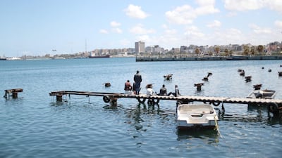 Libyan people fish at the coast of the Mediterranean Sea in Tripoli. Reuters