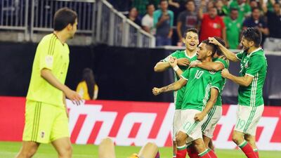 Jesus Manuel Corona celebrates with teammates after his equalising goal against Venezuela. Scott Halleran / Getty Images