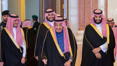 Saudis King Salman leaving a cabinet meeting with Crown Prince Mohammed bin Salman. Courtesy Saudi Press Agency