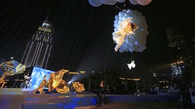 Performers put on a show during the opening ceremony for the Dubai Tour on Tuesday. Sarah Dea / The National