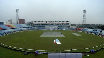A general view shows covers on the playing surface of the Zahur Ahmed Chowdhury Stadium in Chittagong on Friday, with rain washing out Day 4 of the first Test between Bangladesh and South Africa. Munir uz Zaman / AFP / July 24, 2015
