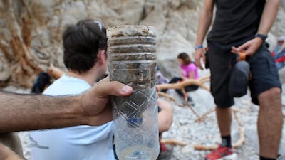 Participants are shown how water can be purified with the help of sand, stone and leaves during the Bear Grylls Survival Academy. Pawan Singh / The National