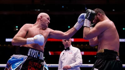 Tyson Fury, left, in action against Arslanbek Makhmudov. Reuters