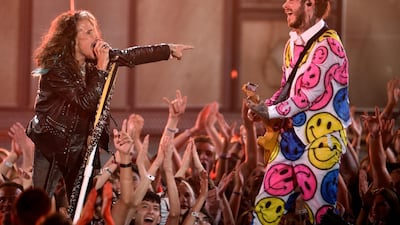 Steven Tyler, left, of Aerosmith, and Post Malone perform. AP