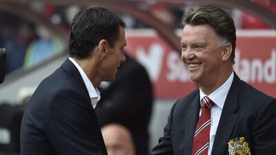 Manchester United manager greets Sunderland manager Gus Poyet before their Premier League match on Sunday. EPA Photo / August 24, 2014