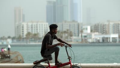 Hazy weather along the corniche in Sharjah. Victor Besa / The National