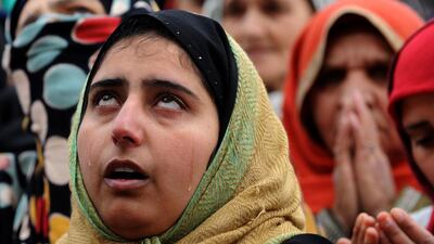 Kashmiri Muslims react as an unseen priest shows a relic believed to be a hair from the beard of the Prophet Mohammed during Eid-e-Milad-un-Nabi, the birthday of the prophet in Srinigar. Rouf Bhat / AFP Photo