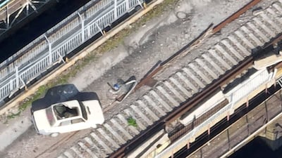 A car on the Kakhovka Dam that appears to be laden with explosives. The dam collapsed on June 6 while under Russian control. AP