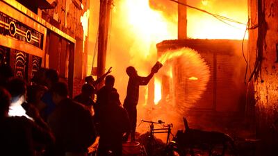 Firefighters and local people help douse a fire in Dhaka, Bangladesh. AP Photo