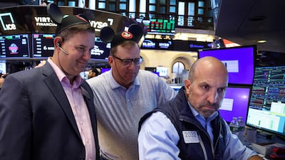 Traders wearing Mickey Mouse ear caps are seen on the floor of the New York Stock Exchange. Reuters